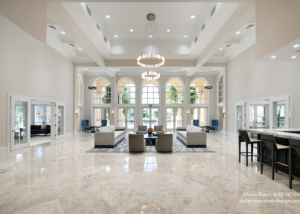 A large lobby with white marble floors and walls.